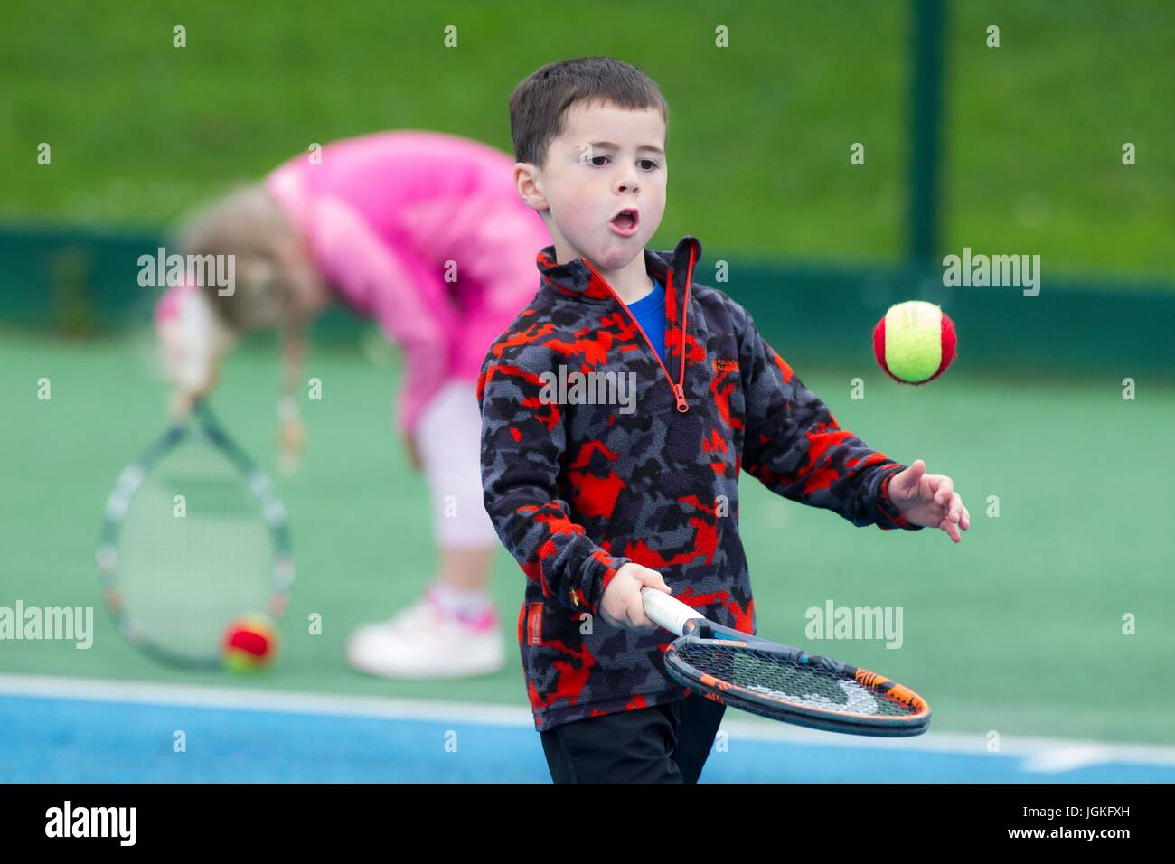 Children playing tennis Stock Photo