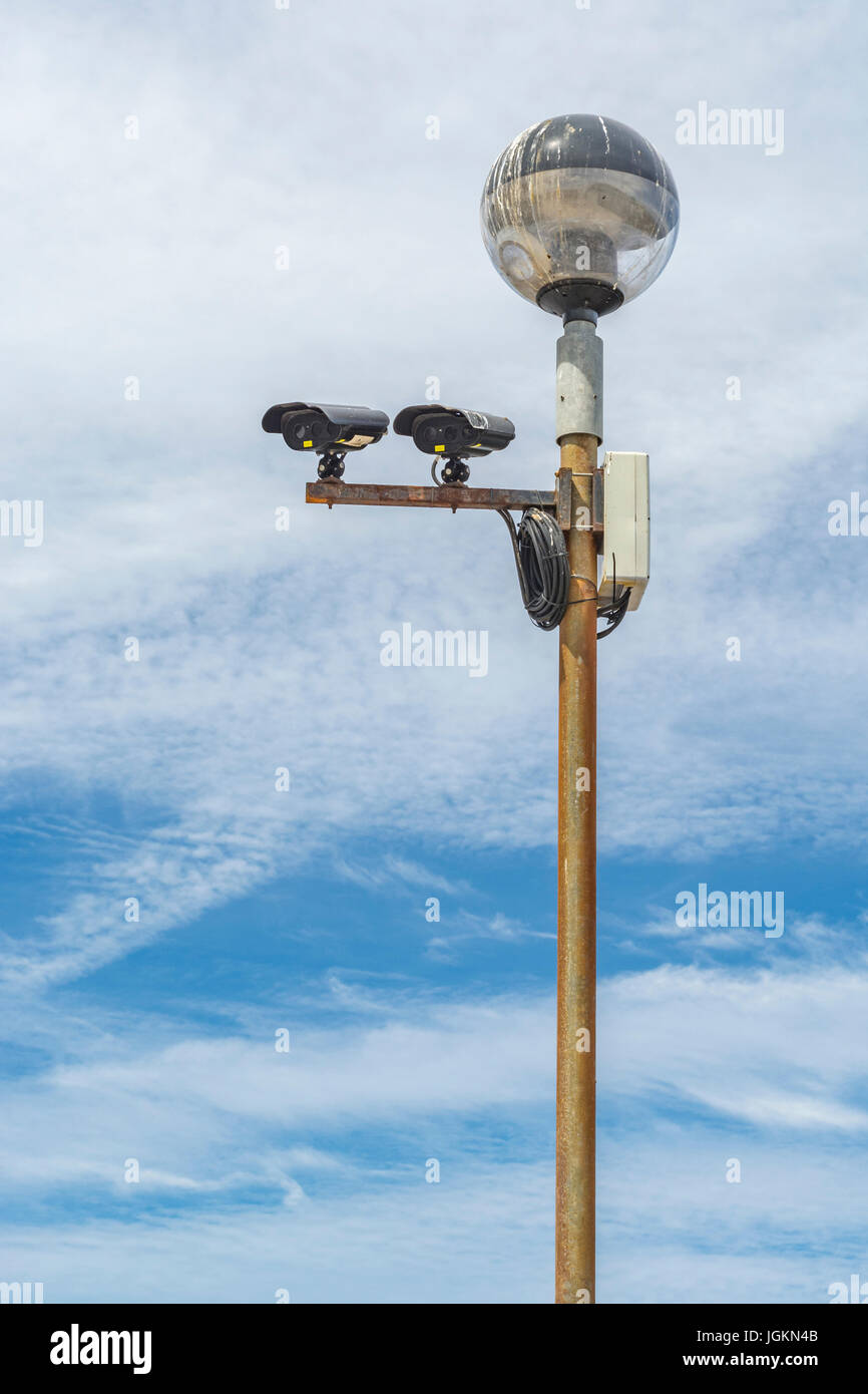 CCTV surveillance cameras mounted on lamp post. Metaphor 'big brother is watching you', 1984, terrorism fear, & mass surveillance, privacy campaigners Stock Photo
