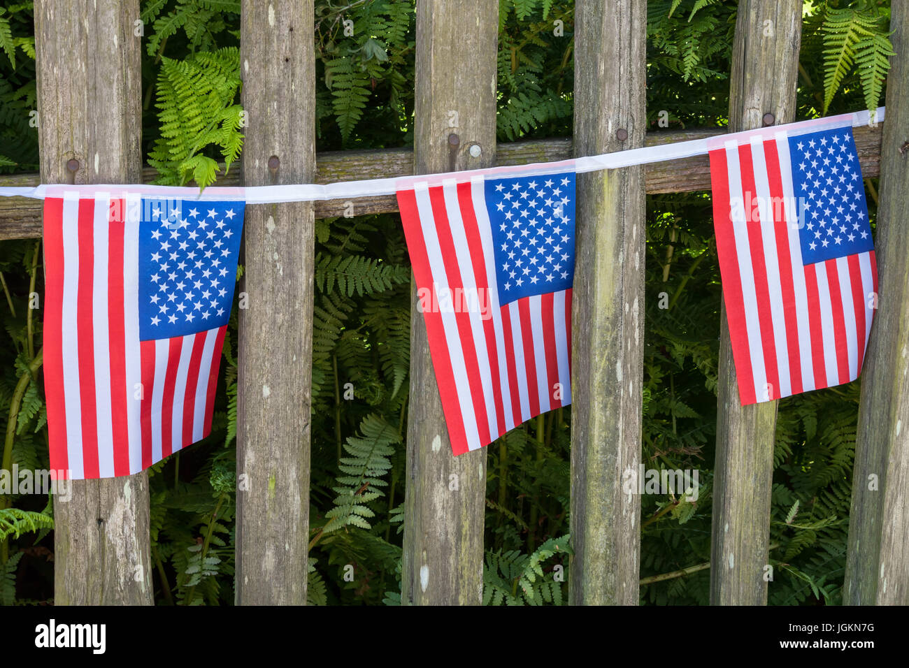 American flags fence patriotic hi-res stock photography and images - Alamy