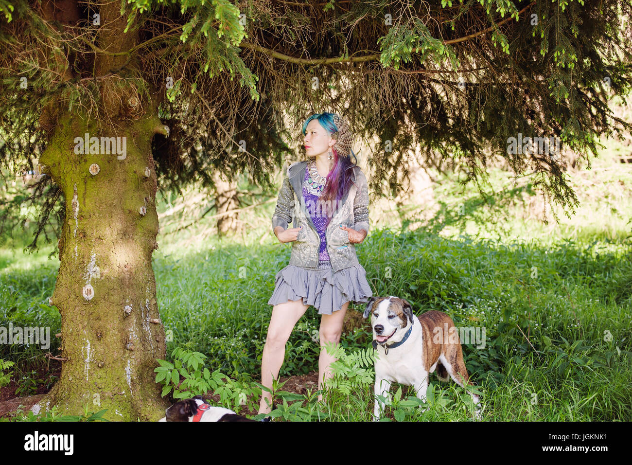 Hippie girl enjoying summer nature with her dog Stock Photo