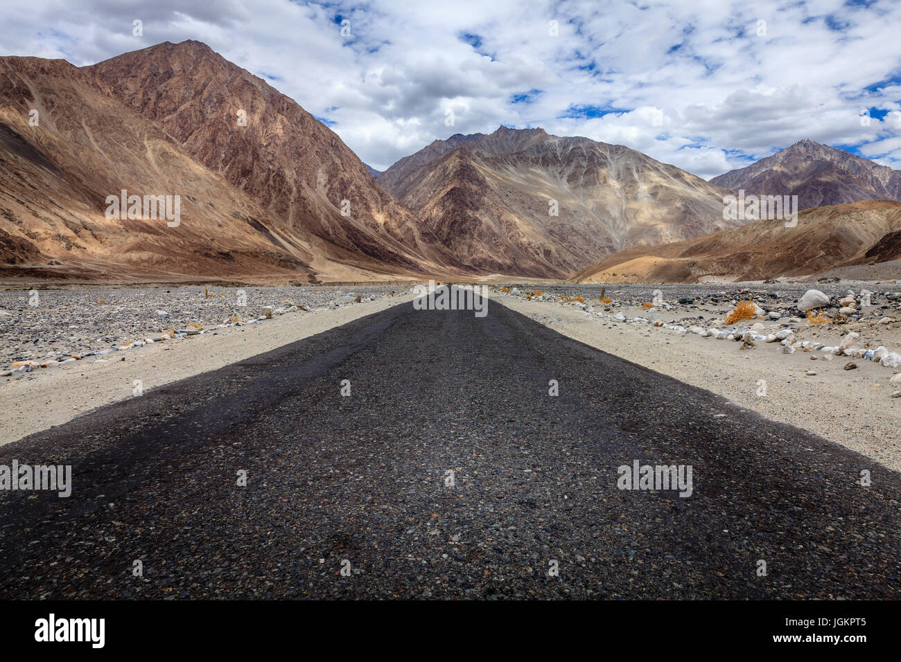 Road through Nubra Valley between Ladakh and Karakoram mountain ranges Stock Photo