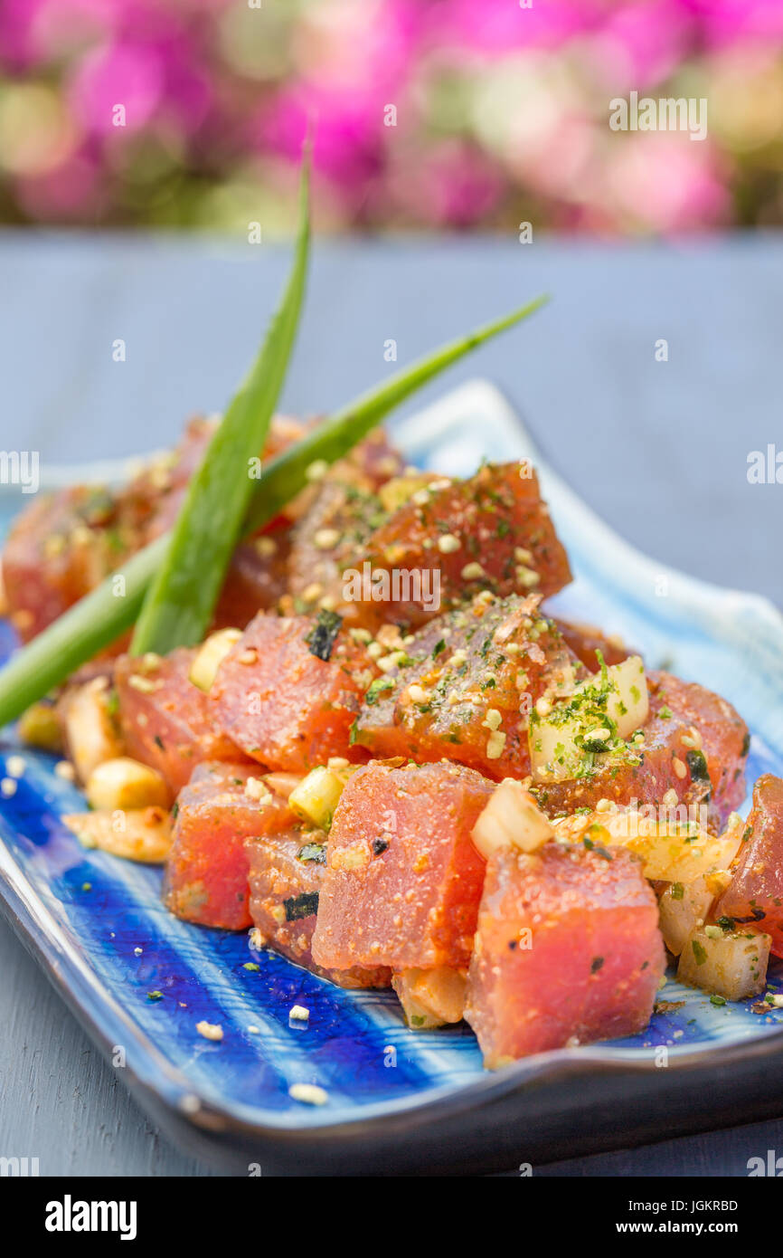 Dices fresh ahi tuna with onions and sprinkled with furikake seasoning