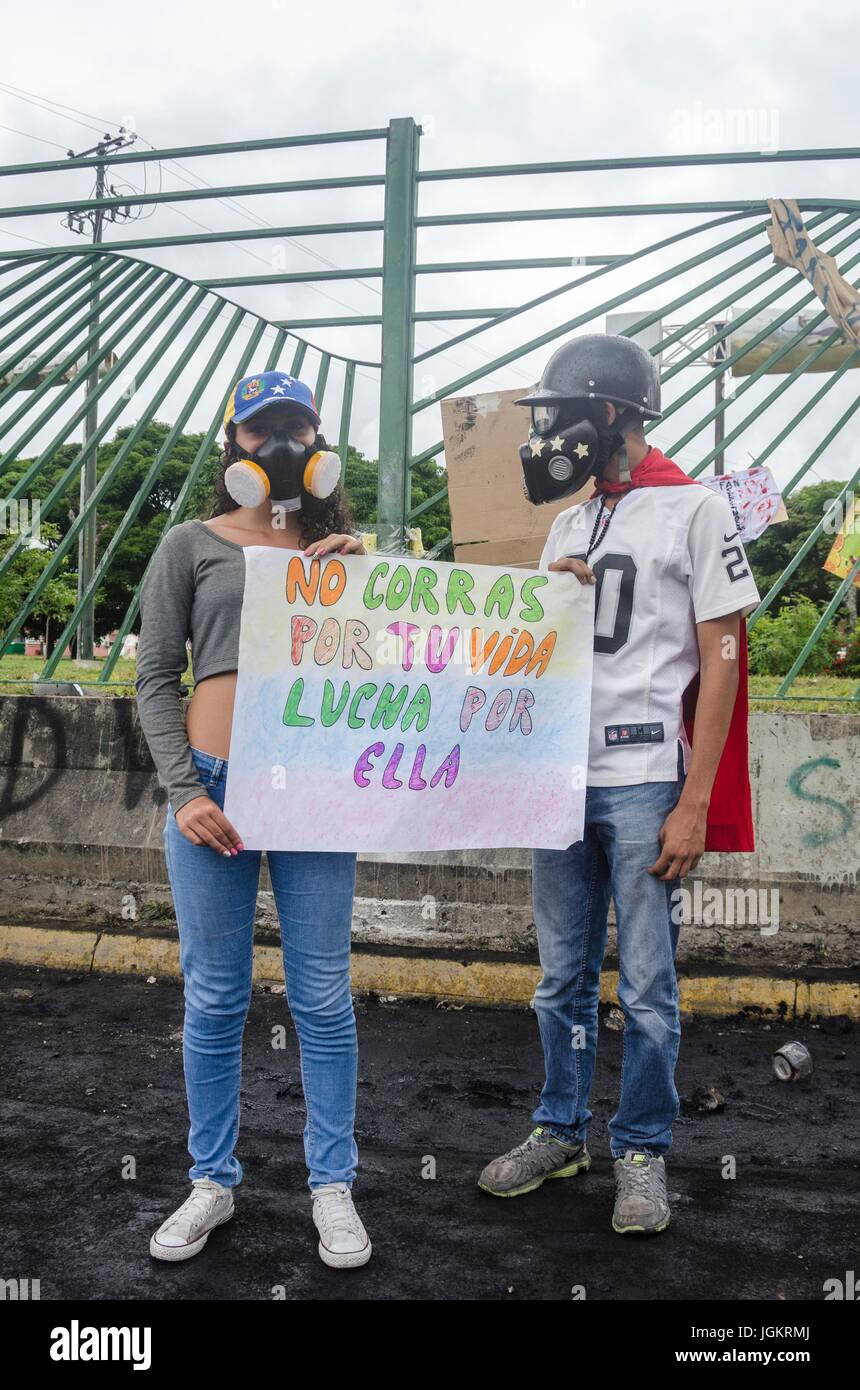 Opposition protesters assembled on the Francisco Fajardo motorway, near Francisco de Miranda Air Force Base in La Carlota, to demand that the Bolivari Stock Photo