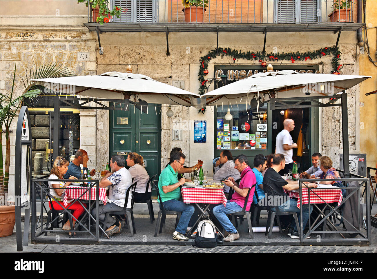 Walking around the historic center (Centro Storico) of Rome, Italy,  the visitor will find hundreds of picturesque, restaurants, pizzerias and cafes. Stock Photo
