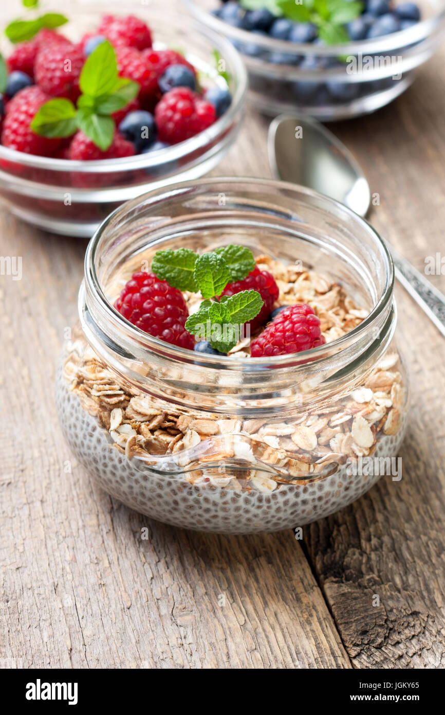 Healthy dietary breakfast. Chia pudding with muesli, raspberries