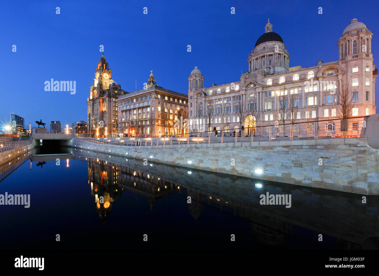Liverpool's 'Three Graces' (left to right: Royal Liver Building, Cunard Building and Port of Liverpool Building) reflected in the canal link. Stock Photo