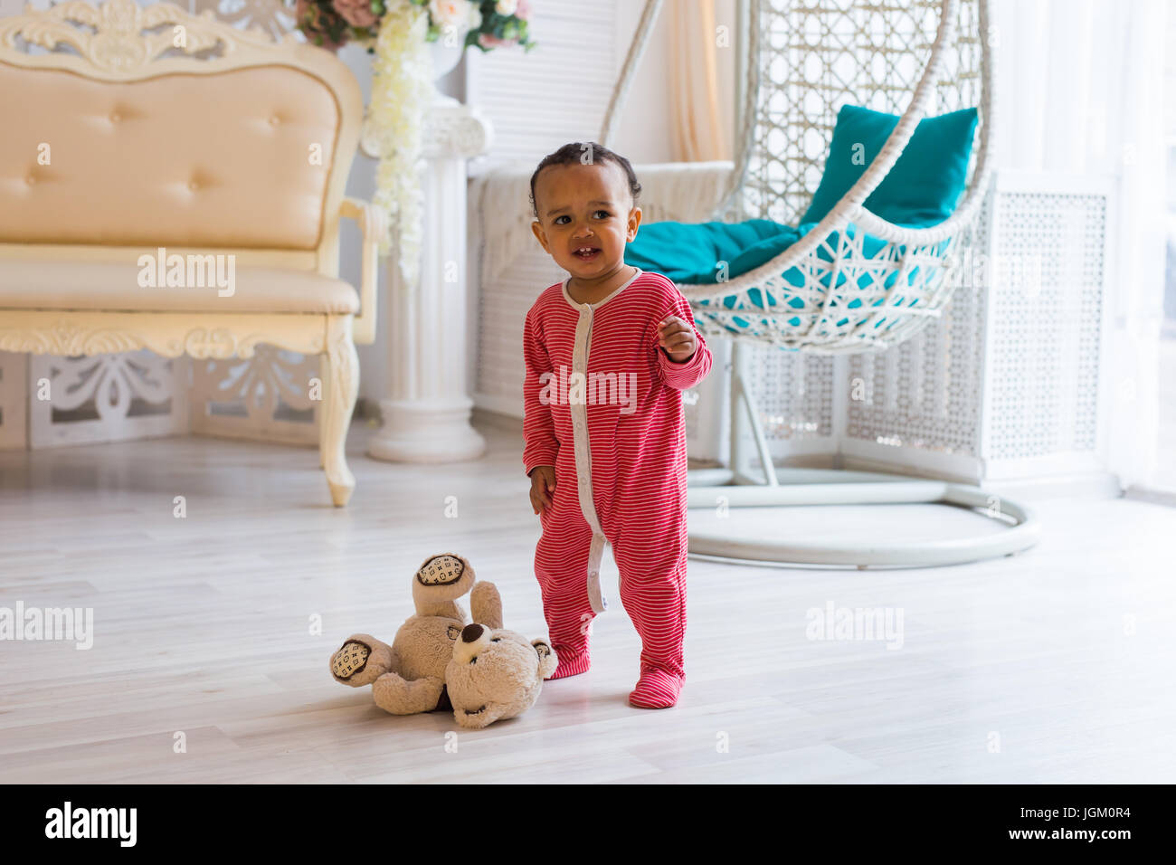 Happy baby boy playing with his teddy bear Stock Photo - Alamy