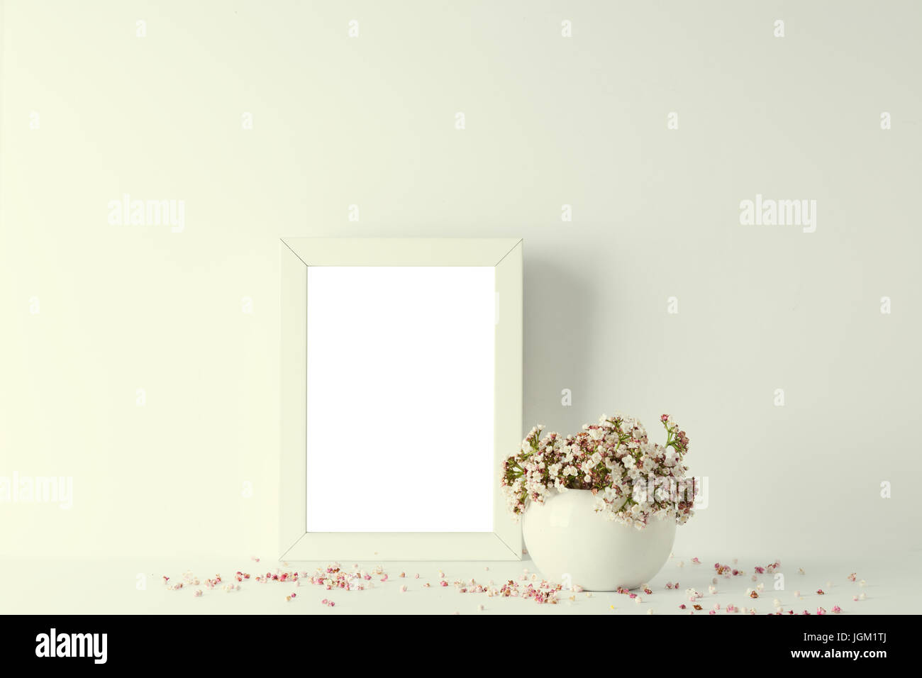 empty picture frame, decorated with small pink flowers and vintage style, white background Stock Photo
