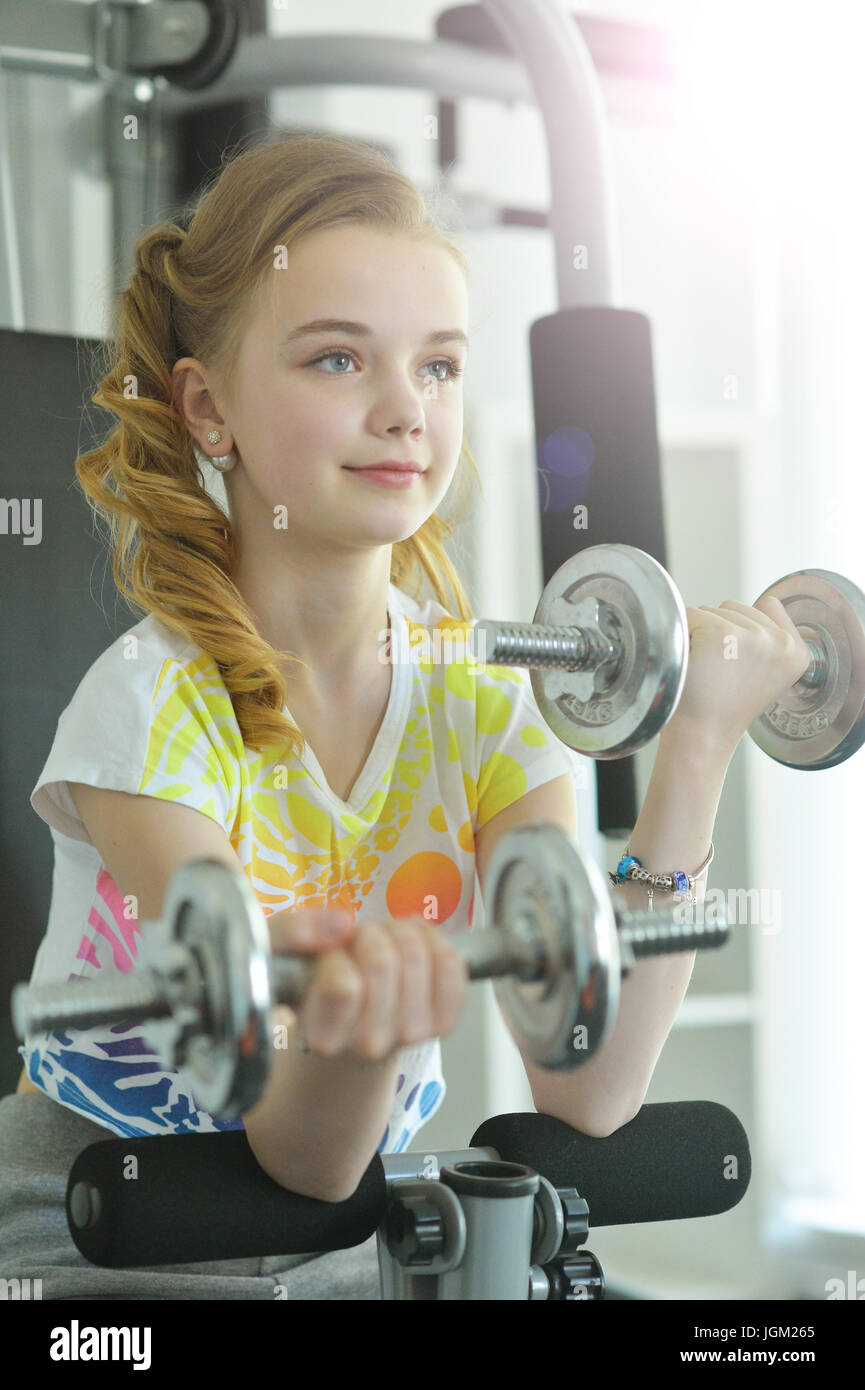 Cute little girl doing exercises Stock Photo Alamy