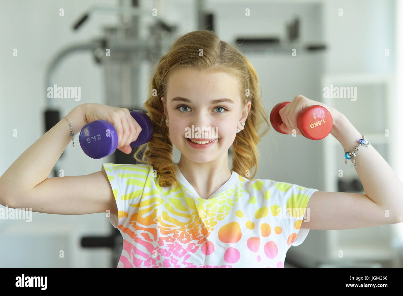 Cute little girl doing exercises Stock Photo - Alamy