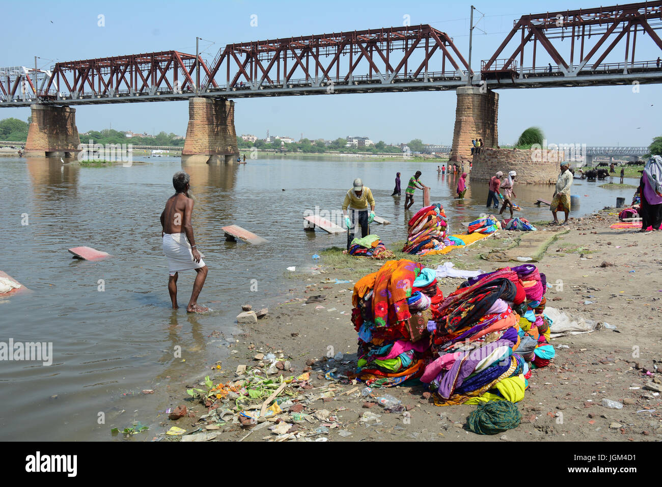 Agra, India Jul 13, 2015. People washing and drying cloth on the