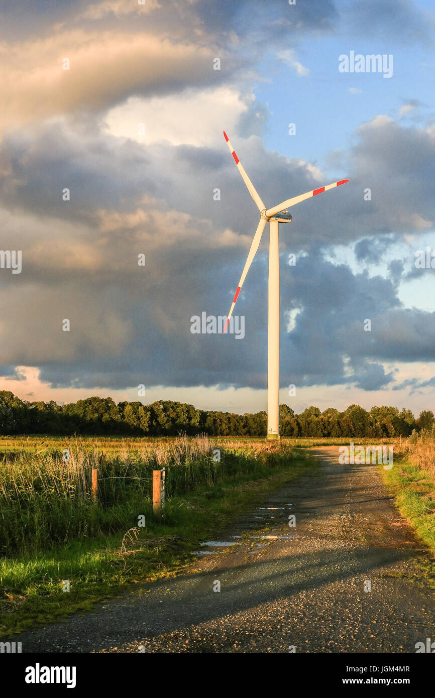 Europe, the Federal Republic of Germany, Friesland, Lower Saxony, wind strength arrangement, cloud sky, evening mood, wind turbine, wind turbines, win Stock Photo
