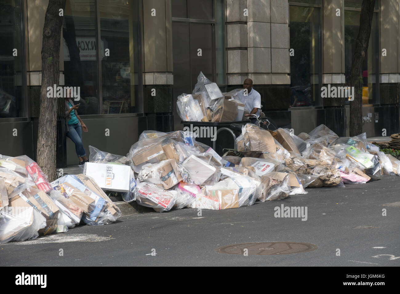 Recyclible garbage being put on the curb in NY City where there are no