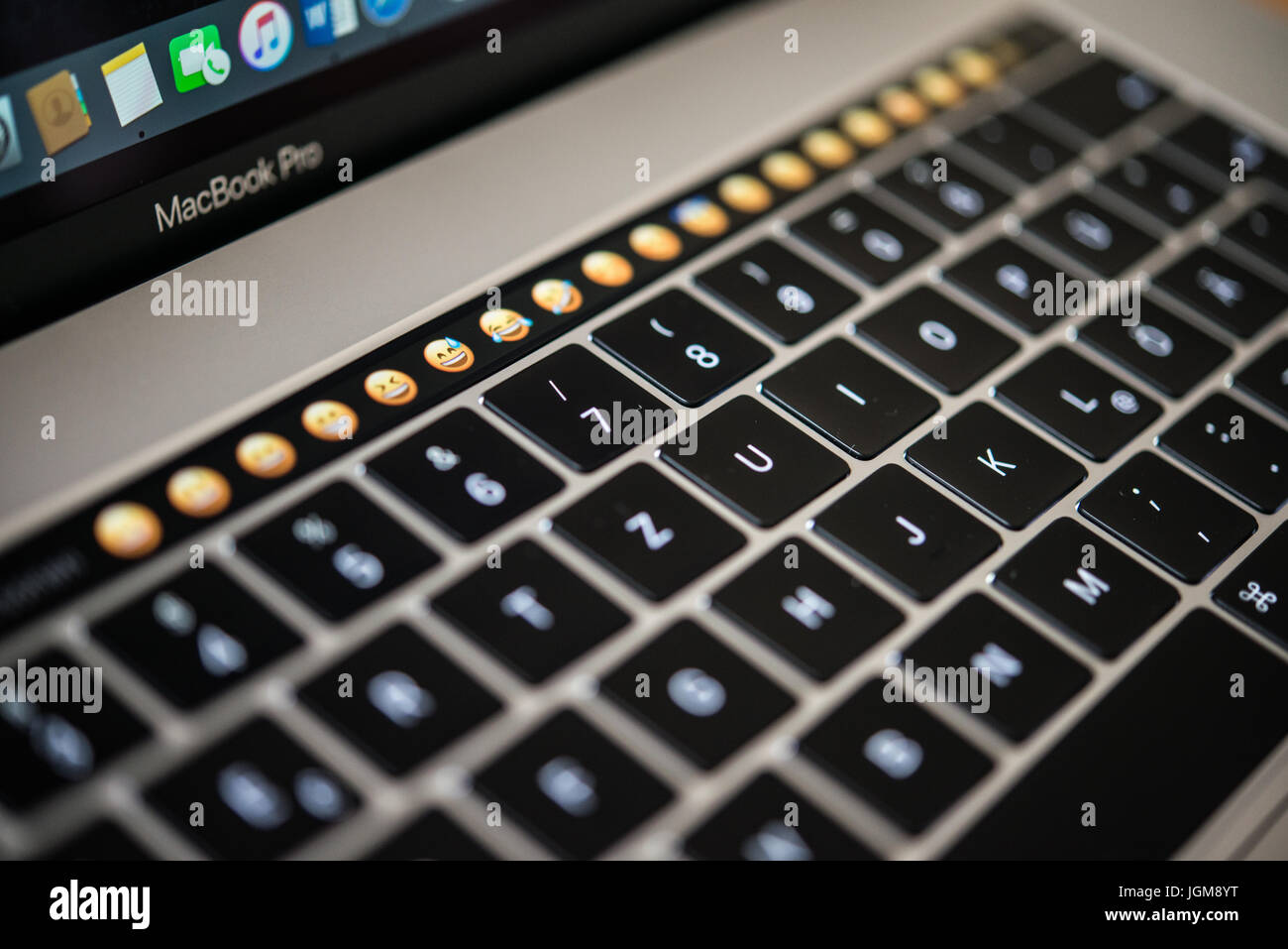 Backlit keyboard and Touch Bar showing emoticons, laptop, Apple MacBook Pro,  close-up Stock Photo - Alamy