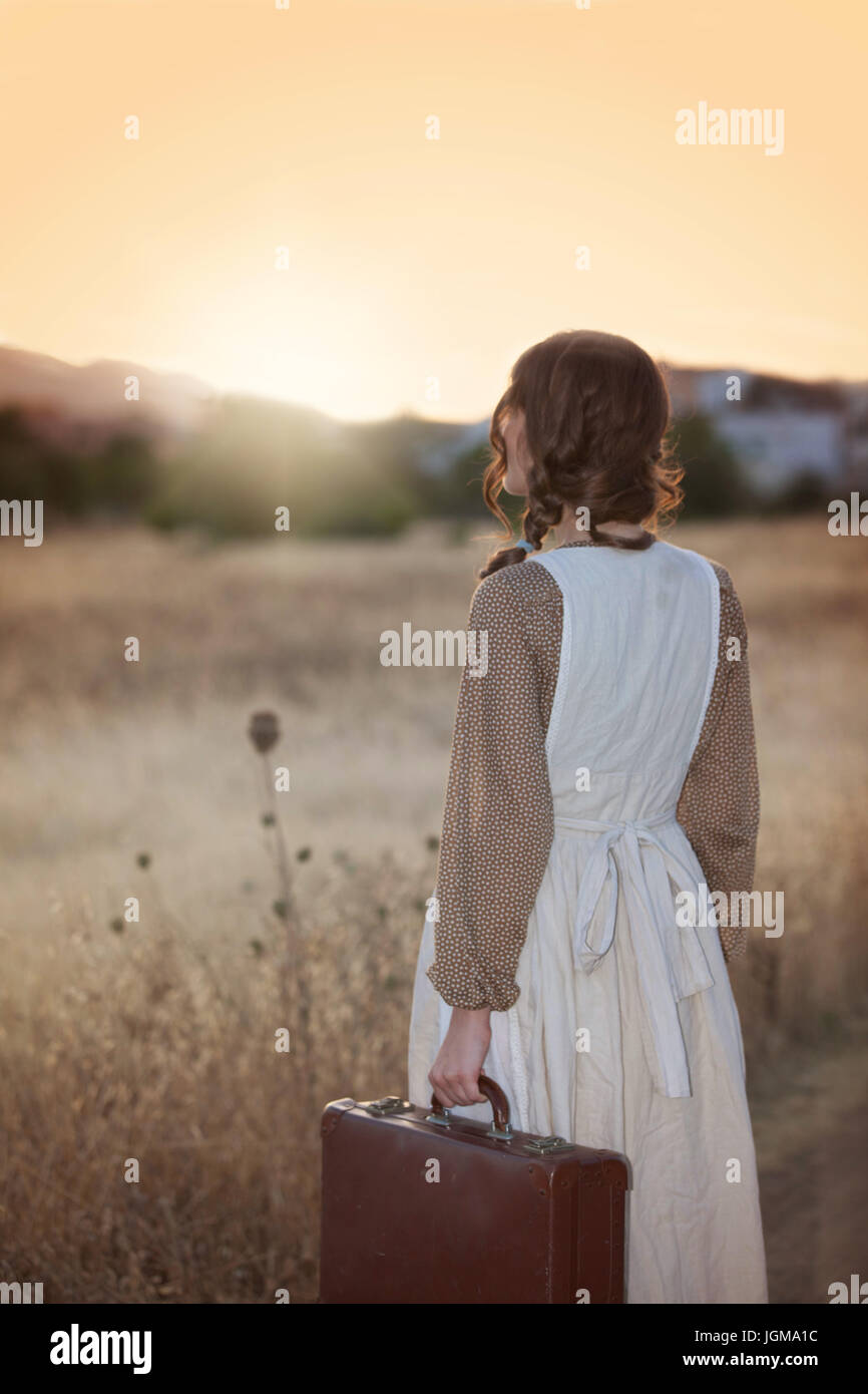 nostalgia, woman leaving home Stock Photo