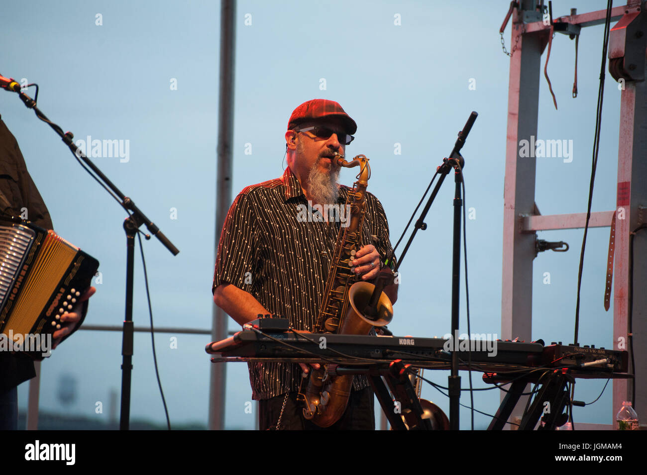 Steven Berlin, a saxophonist and keyboardist, playing with Los Lobos during  a River and Blues Festival concert in Battery Park City's Wagner Park. Jul  Stock Photo - Alamy