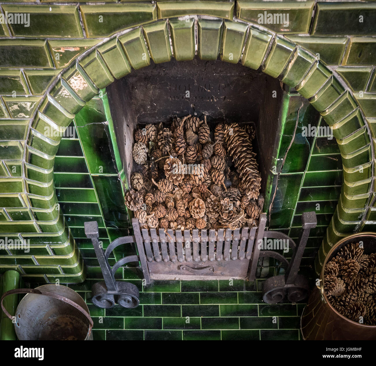 A Fireplace With Decorative Pine Cones Stock Photo 147965595 Alamy