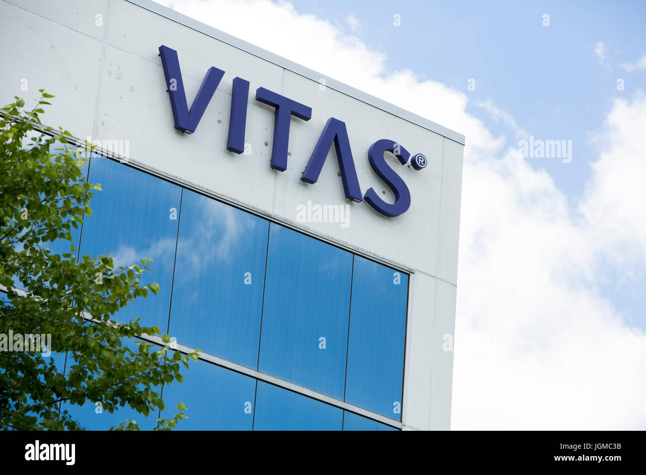 A logo sign outside of a facility occupied by VITAS Healthcare in