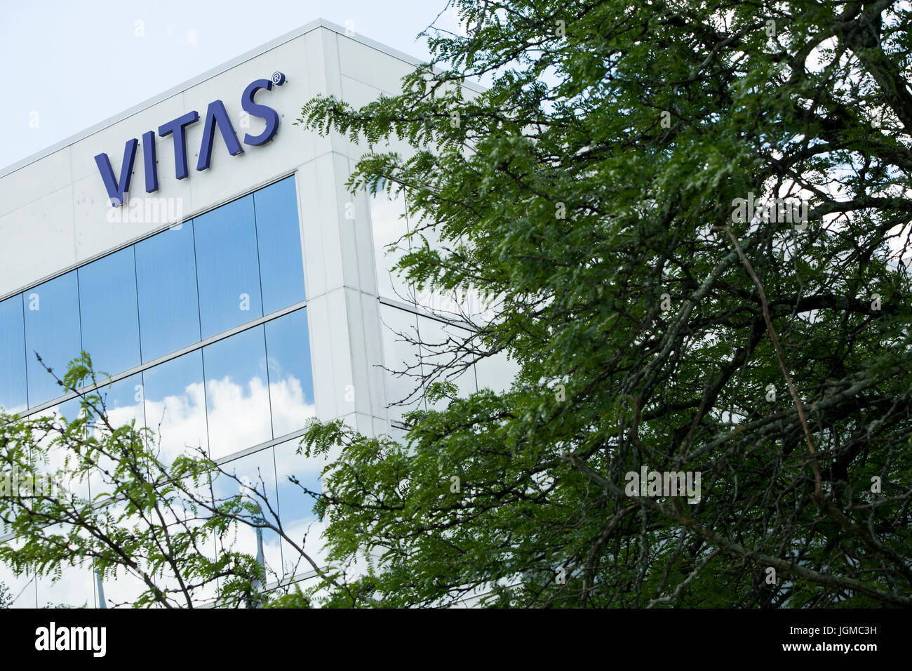 A logo sign outside of a facility occupied by VITAS Healthcare in