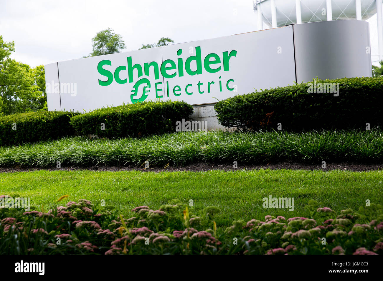 A logo sign outside of a facility occupied by Schneider Electric in