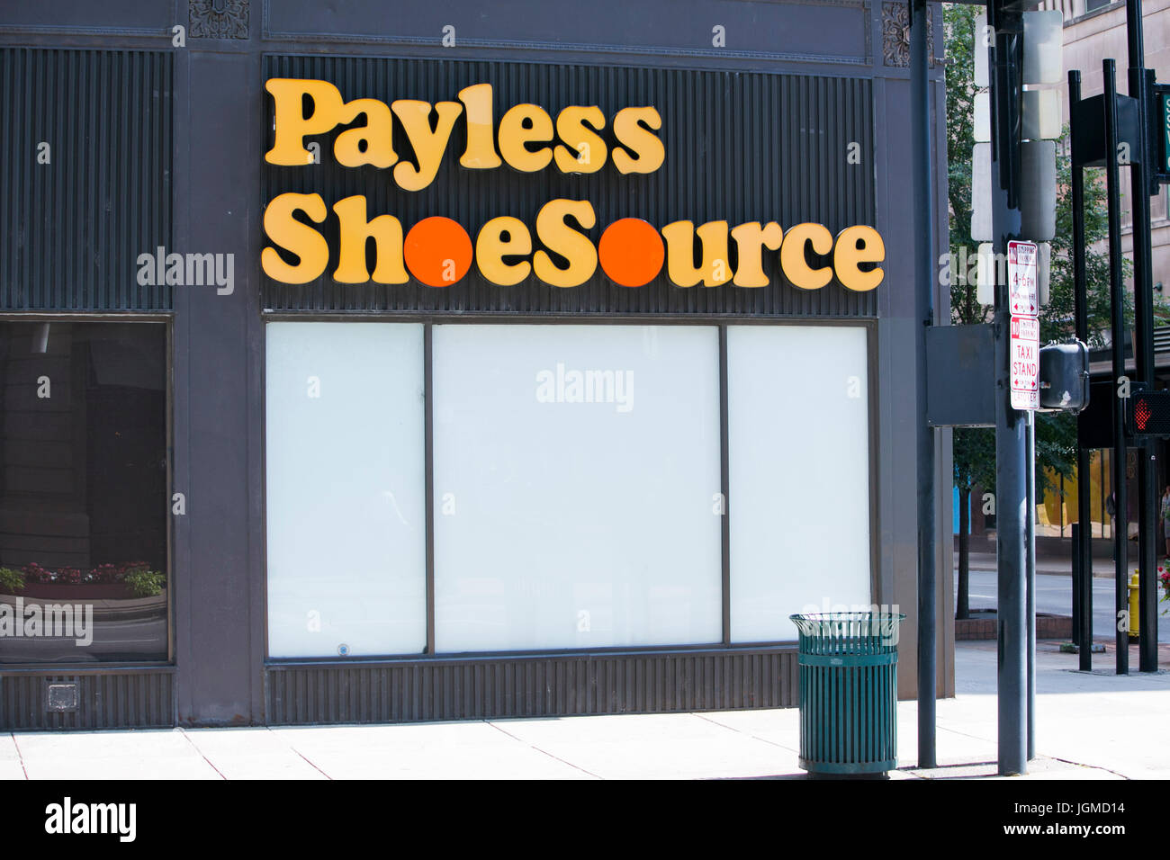 A logo sign outside of a shuttered Payless ShoeSource Inc., retail store in Cincinnati, Ohio on June 29, 2017. Stock Photo