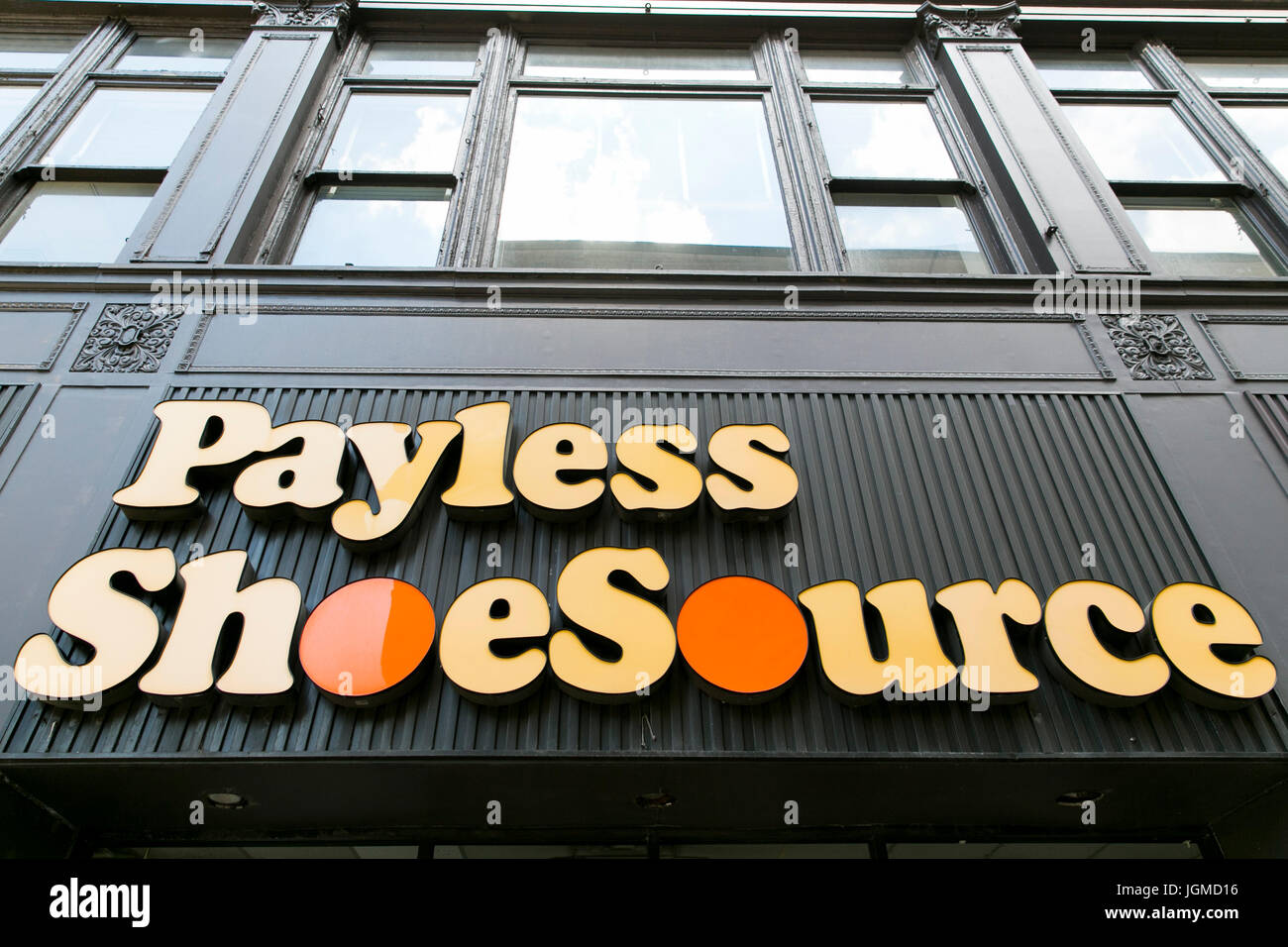 A logo sign outside of a shuttered Payless ShoeSource Inc., retail store in Cincinnati, Ohio on June 29, 2017. Stock Photo