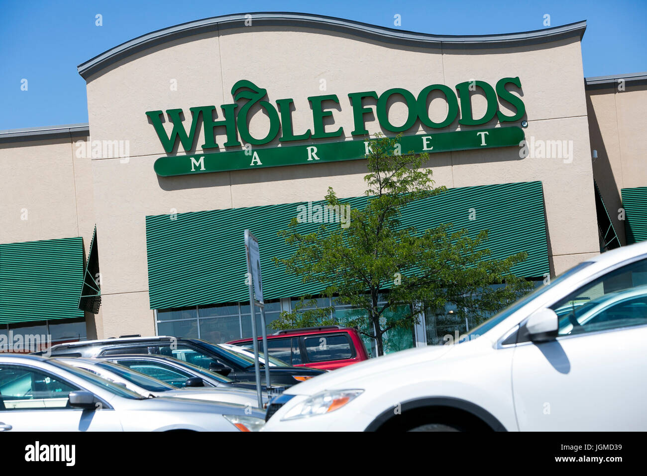 A logo sign outside of a Whole Foods retail grocery store in Mason, Ohio on July 2, 2017. Stock Photo