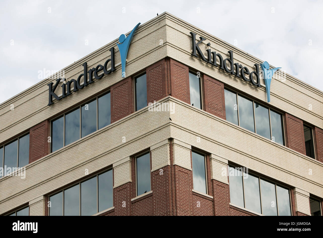 A logo sign outside of the headquarters of Kindred Healthcare in