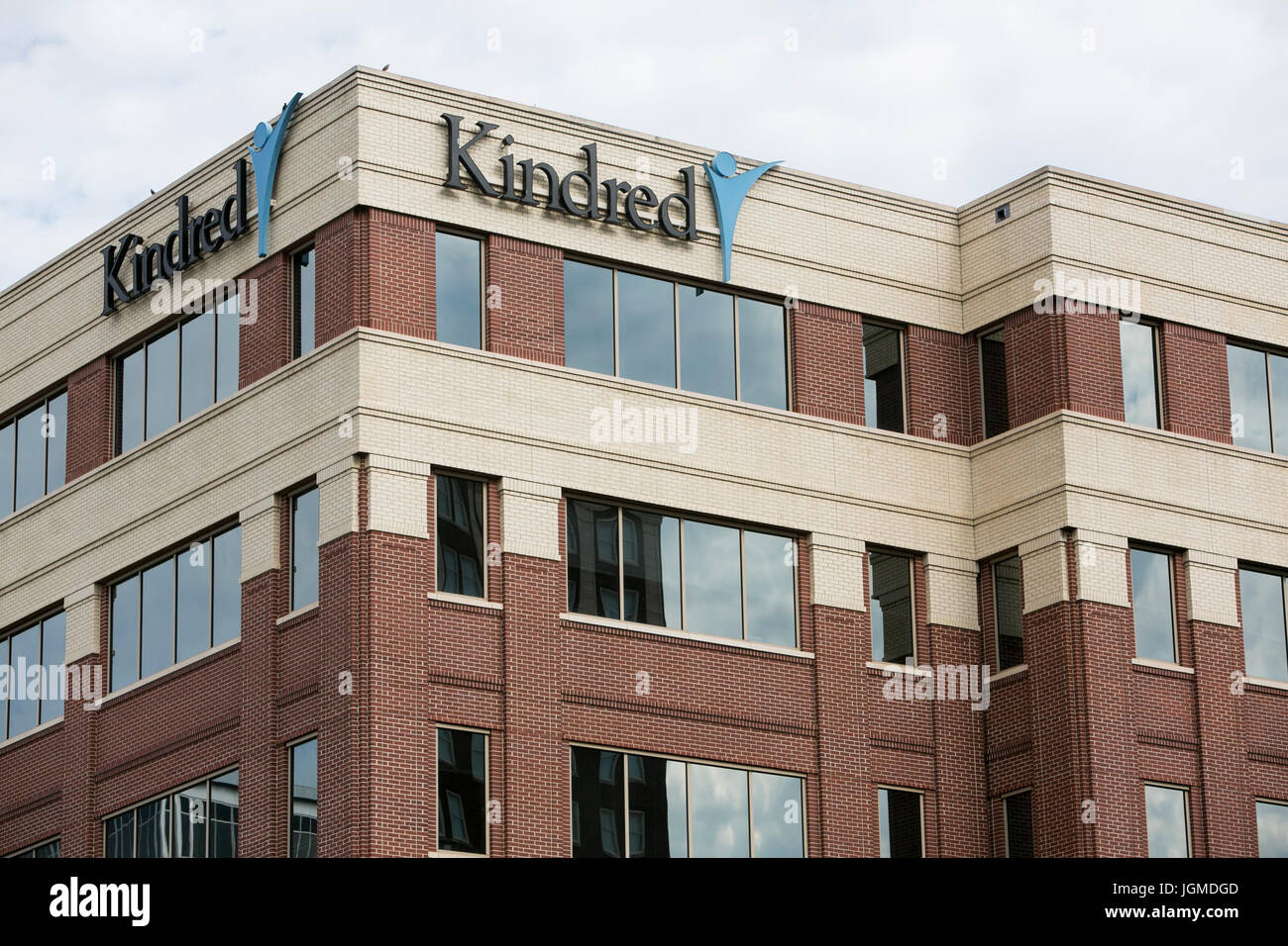 A logo sign outside of the headquarters of Kindred Healthcare in
