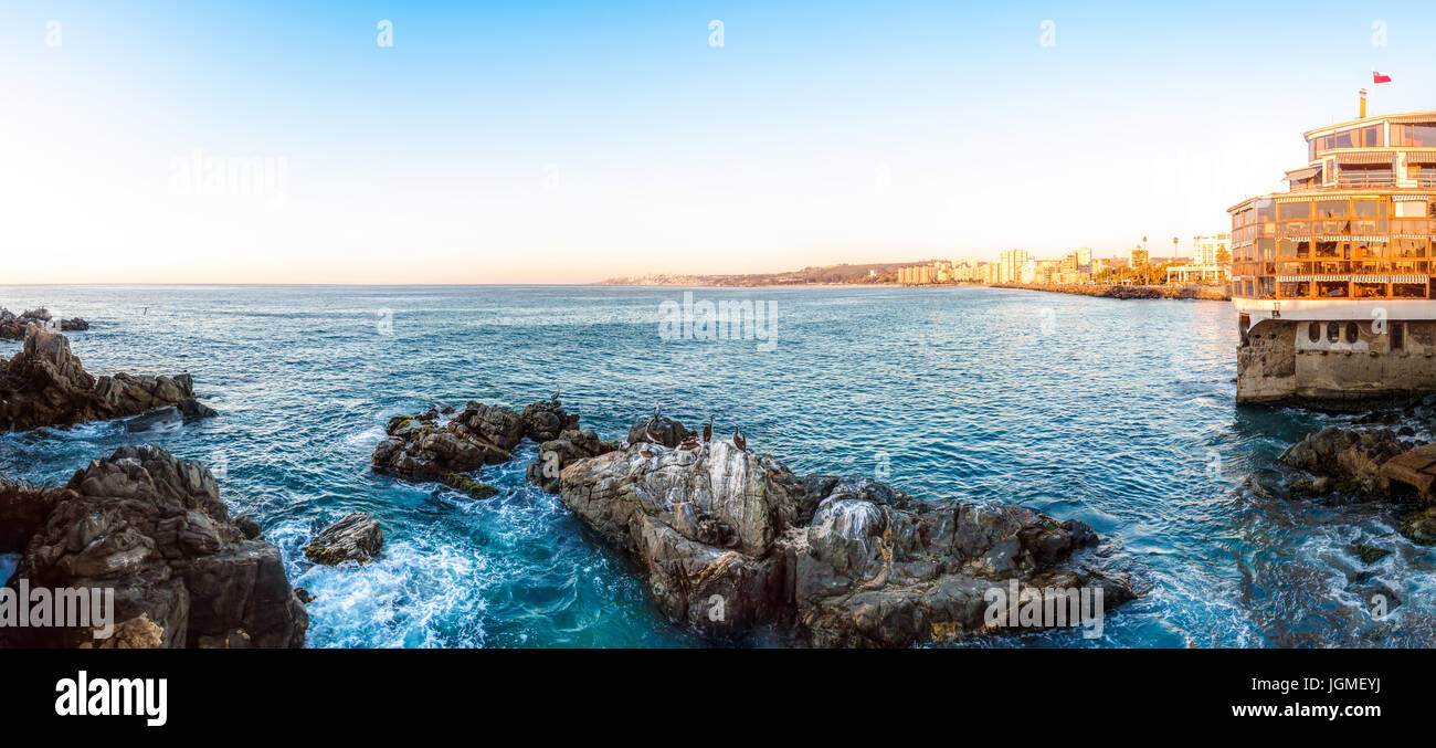 Panoramic view of the coastline in Vina del Mar, Chile with sea rocks on the foreground Stock Photo