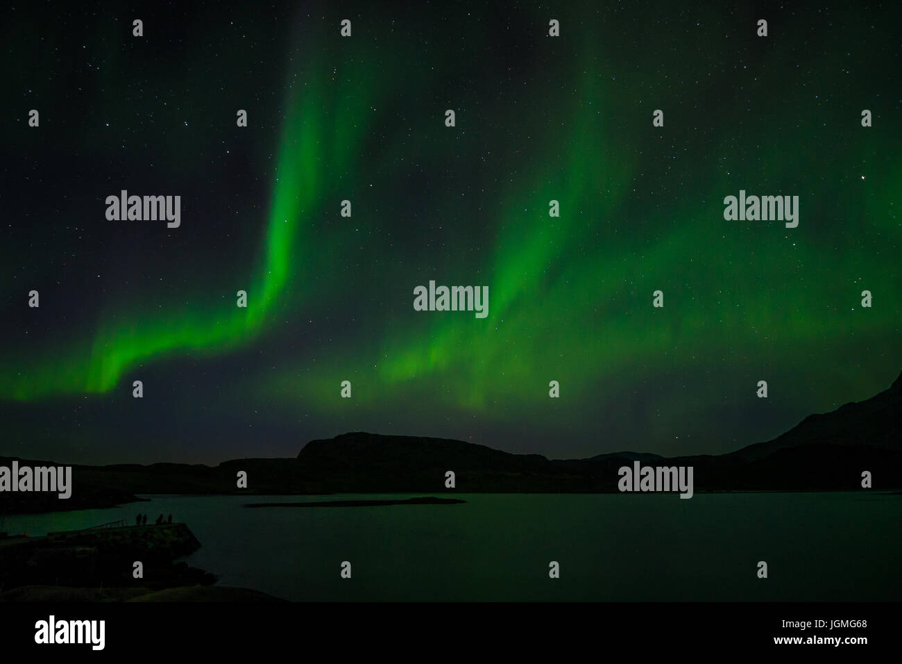 Northern lights at night over a lake in Igaliko, Greenland Stock Photo