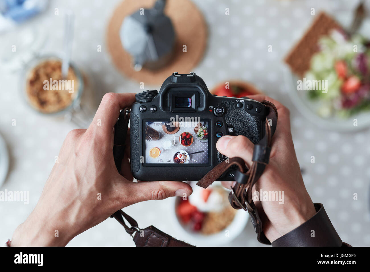 Professional food-photographer making shot of food for advert Stock Photo