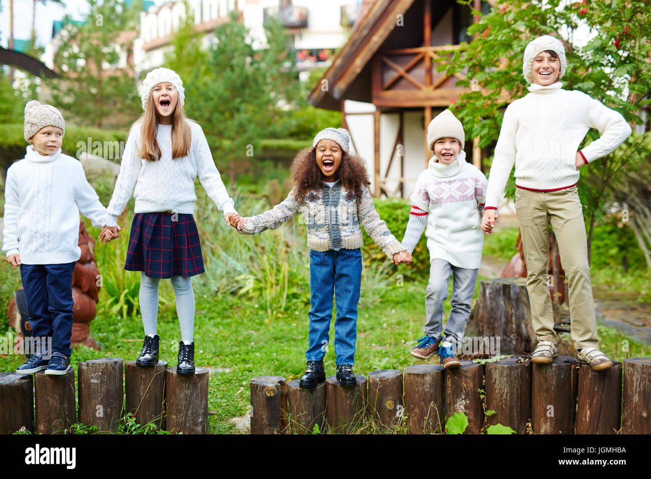 Kids Holding Hands Row Happy High Resolution Stock Photography and ...