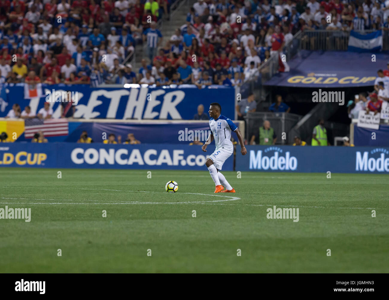 Ever Alvarado (5) of Honduras National team controls ball during CONCACAF Gold Cup group stage game against Costa Rica national team at Red Bulls Aren Stock Photo