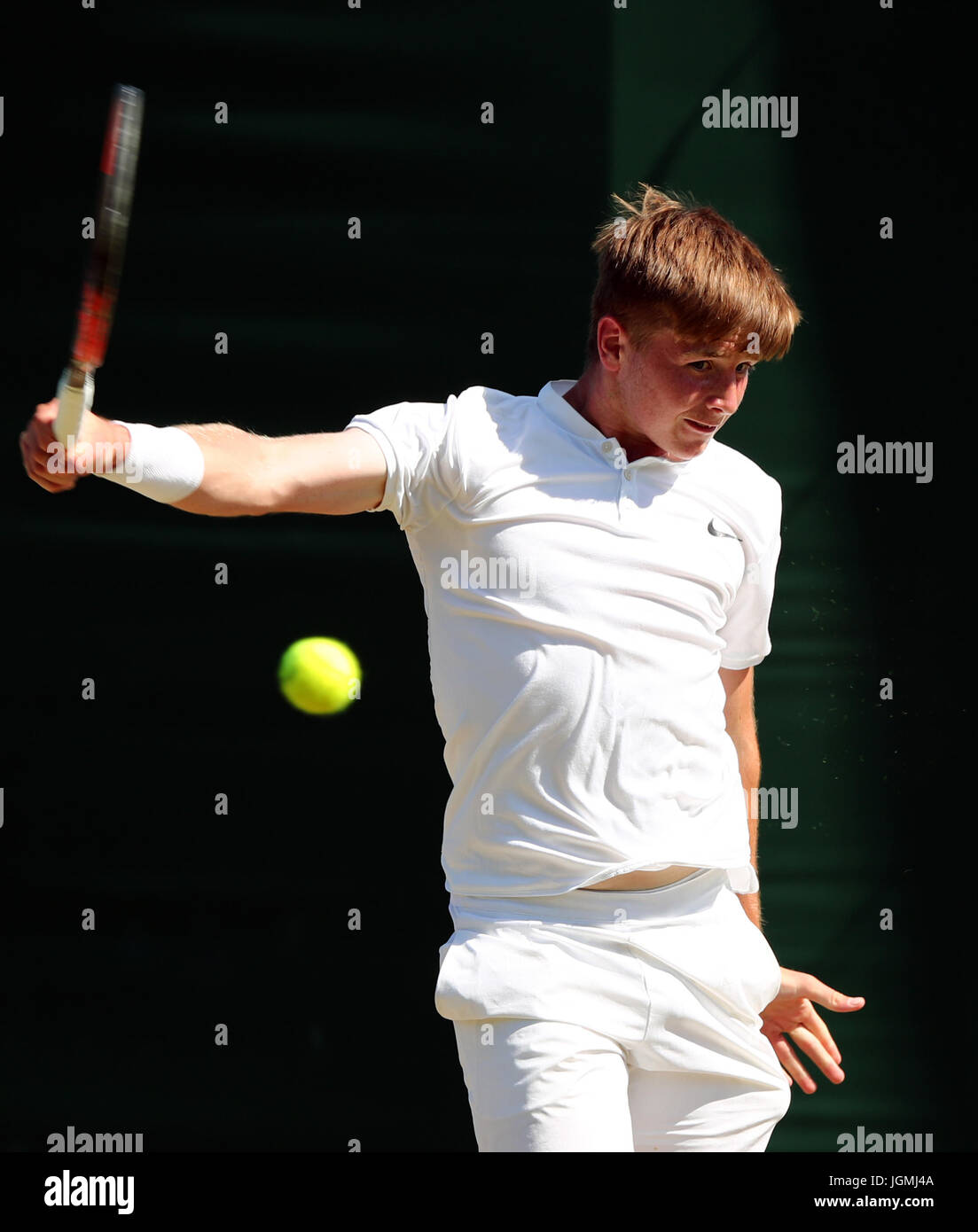 Aidan McHugh competes in the boys singles on day six of the Wimbledon ...