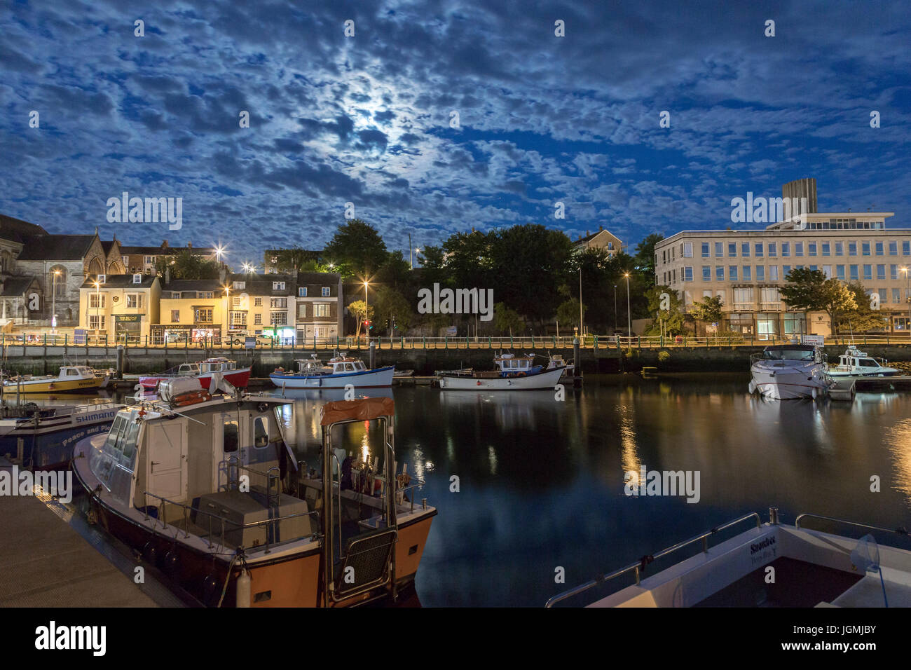 weymouth old harbour dusk into night with moonlight on the river wey ...