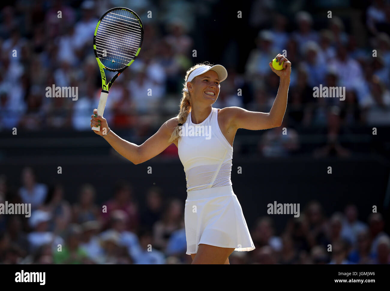 Caroline Wozniacki celebrates beating Anett Kontaveit on day six of the