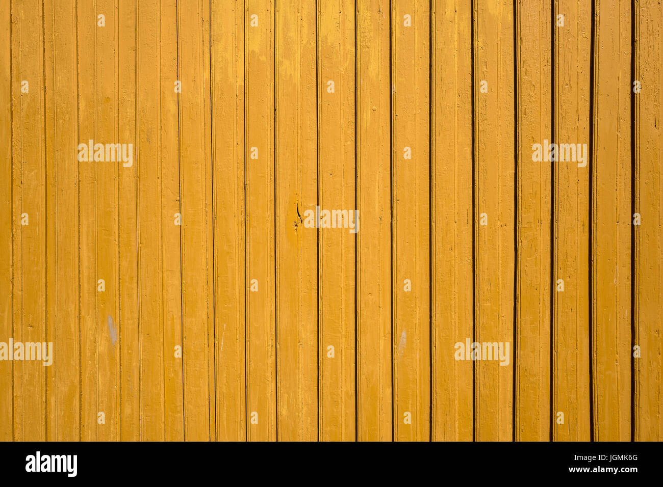 exterior wall of a typical yellow colored Norwegian wooden house Stock