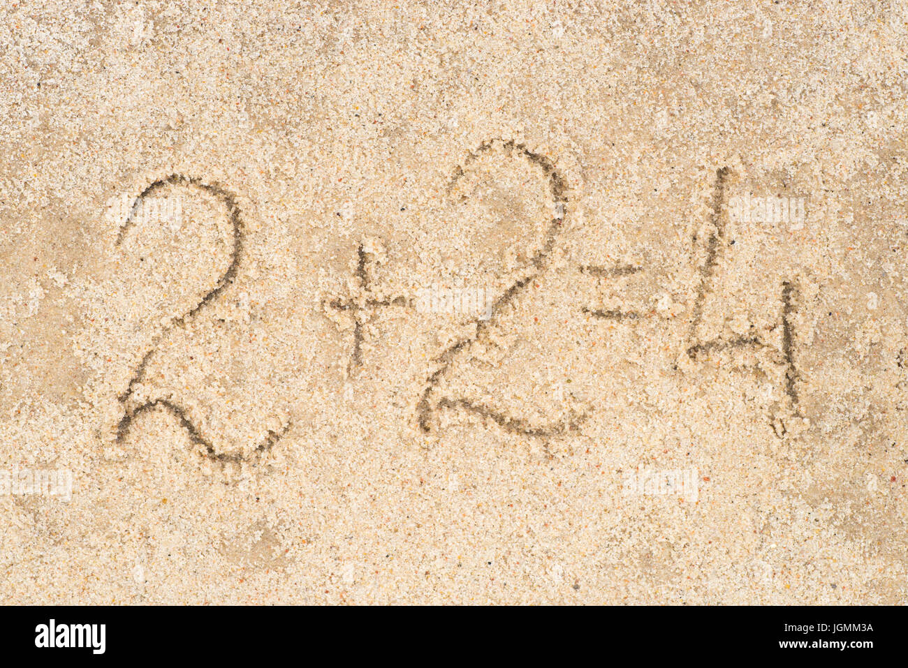 2+2=4 written in sand background Stock Photo - Alamy