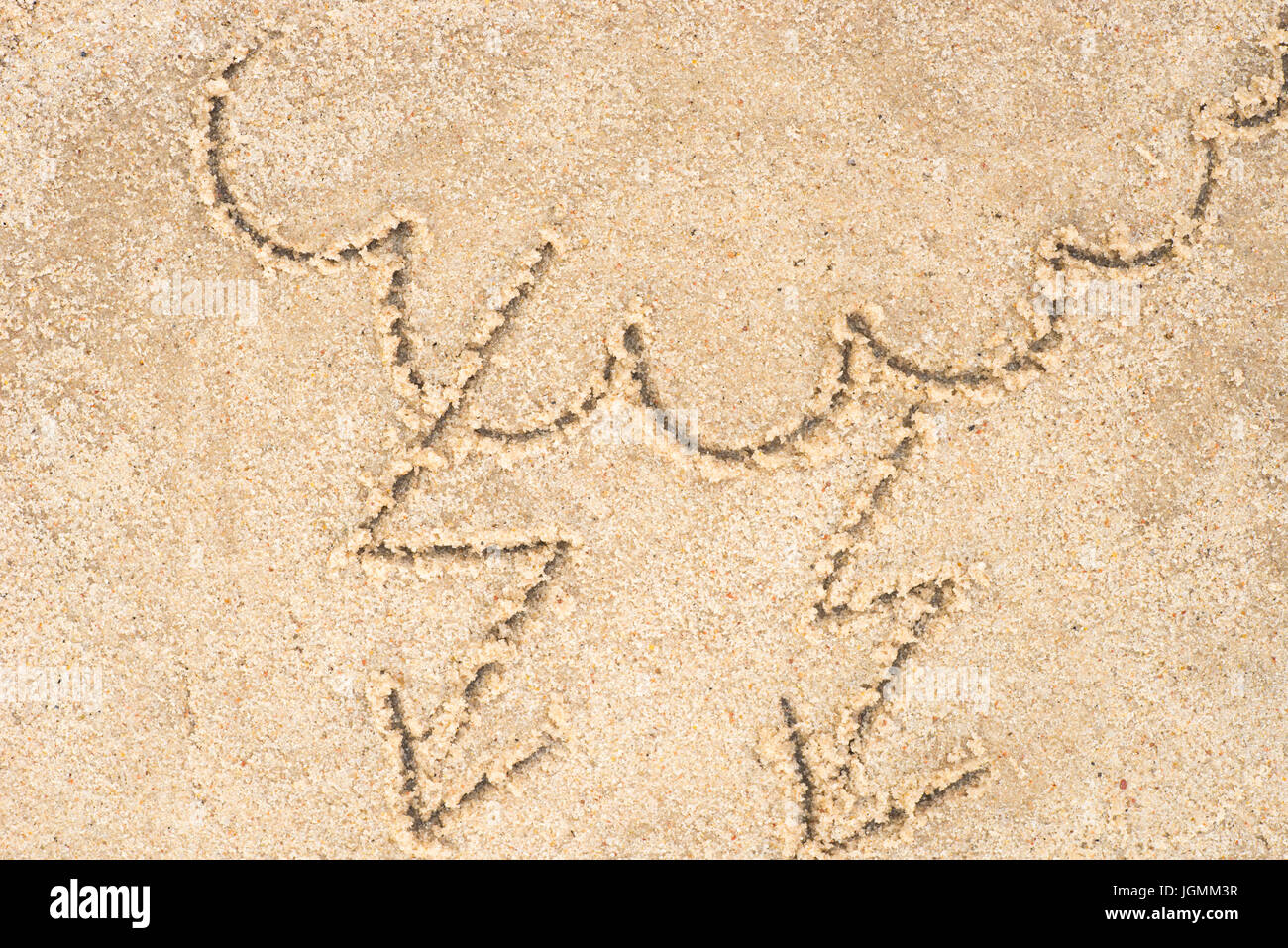 stormy clouds drawing in sand background Stock Photo