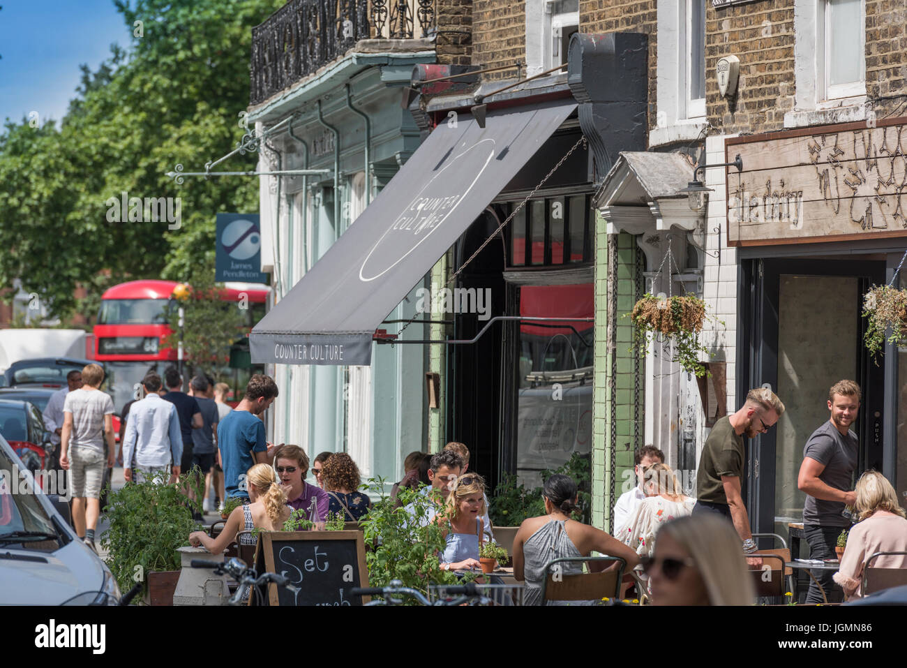 General street view of street life near Clapham Common, on 'The Pavement' in London, Enlgland UK Stock Photo