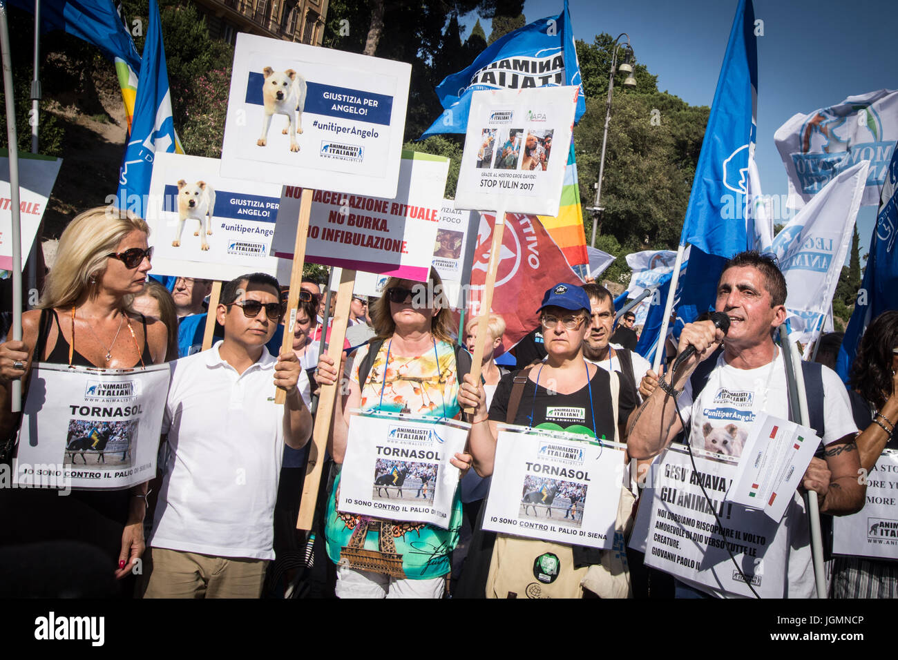 Rome, Italy July 08, The animal movement, founded by Michela Vittoria Brambilla last May 20, fell fot the first time in the piazza In Rome to ask for' justice for all' and to fight against the ill-treatment of animals .During the demonstration, departed from the Colosseum and ended in Piazza Venezia with several interventions from the stage, the president and founder Michela Vittoria Brambilla said: 'We no longer want to delgate the defenseof animals and support to the people who live with their four - leggend frieds, for this reason we deided to commit ourselvesin the first personwith this Stock Photo