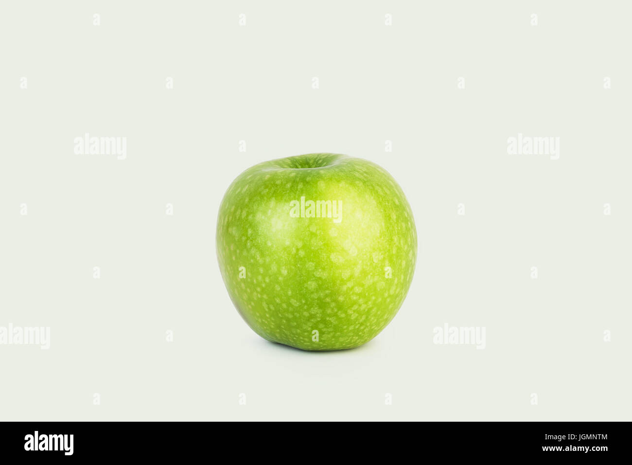 Fresh big green apple on white isolated background in the middle Stock ...