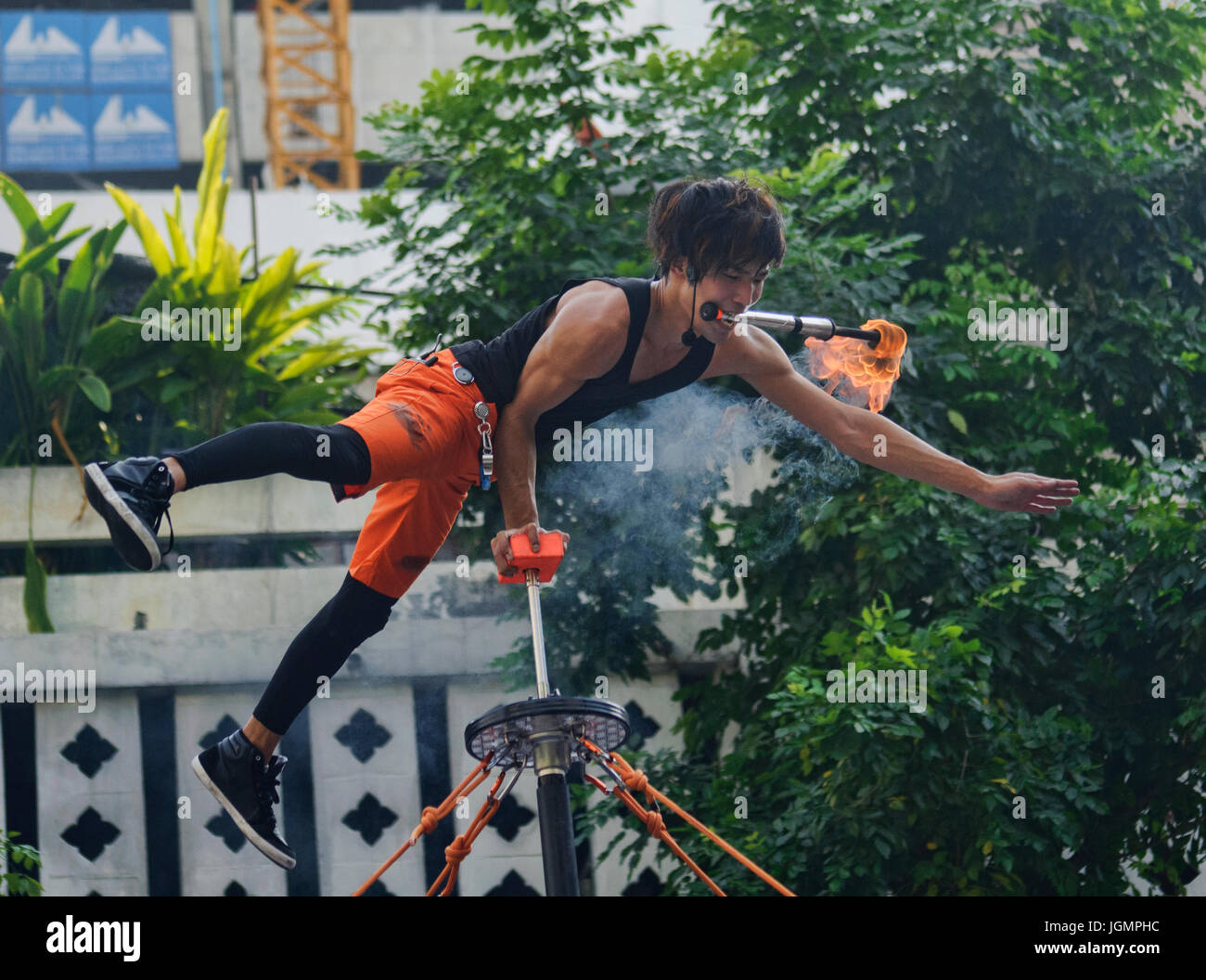 Fire juggling at a street festival in Bangkok, Thailand Stock Photo