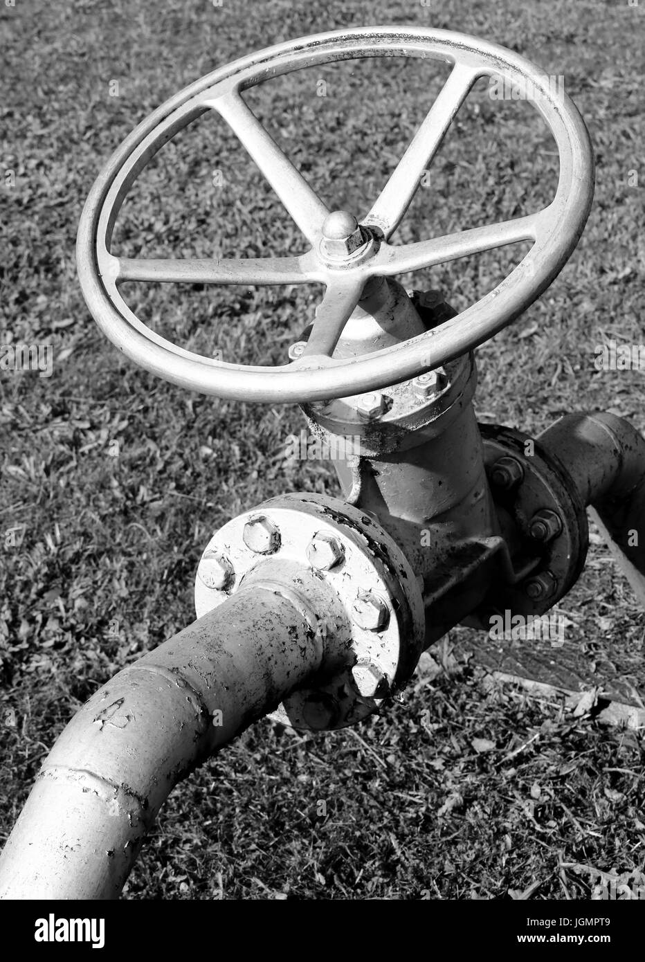 Large pipe valve of the industrial plant Stock Photo