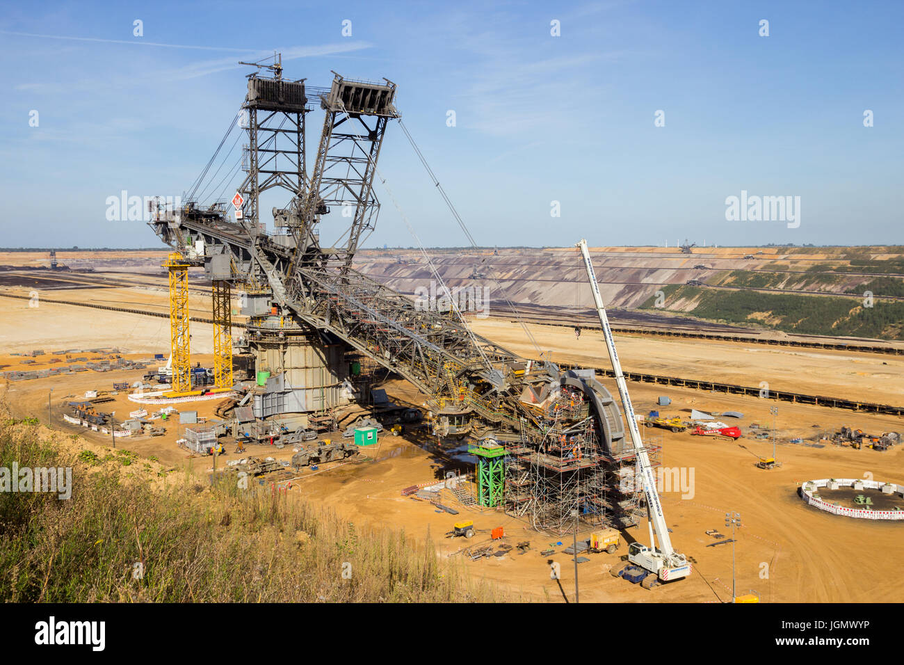 INDEN, GERMANY - JUNE 30, 2012: Construction of a large mining bucket-wheel excavator to dig for brown-coal in the open-pit mine at Inden, Germany. Stock Photo