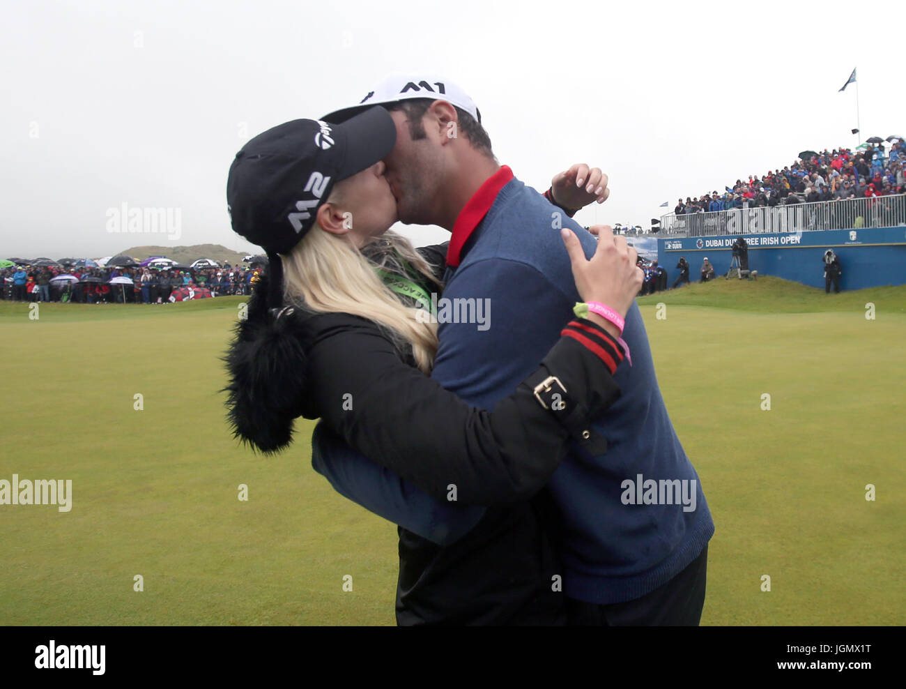 Spain's Jon Rahm kisses girlfriend Kelley Cahill as he celebrates winning the Dubai Duty Free Irish Open at Portstewart Golf Club. Stock Photo