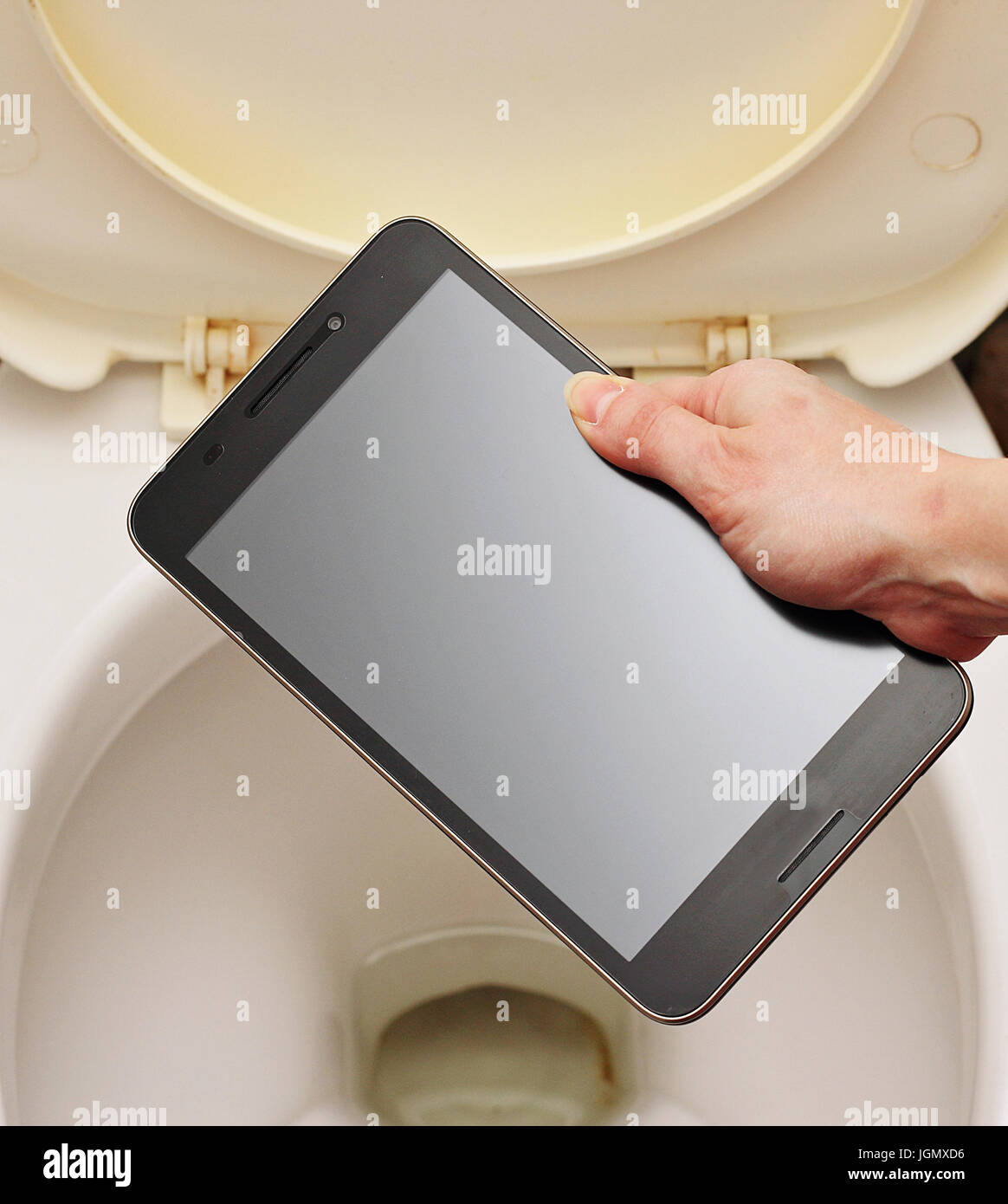A woman without regret throwing the toilet smartphone Stock Photo Alamy