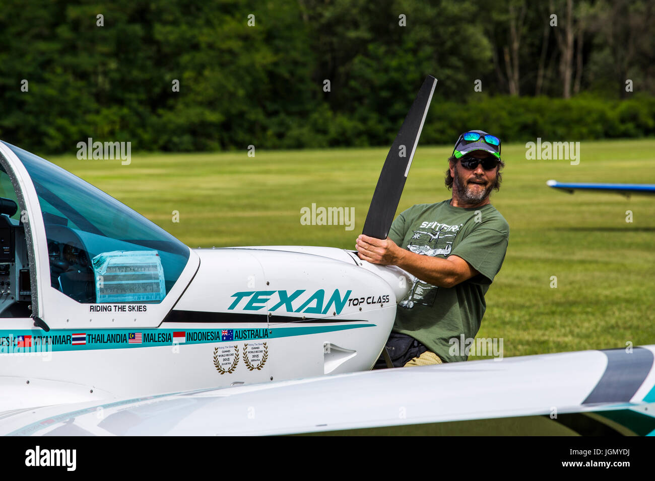 Man pulling the Texan top class touristic airplane to the runway. Stock Photo