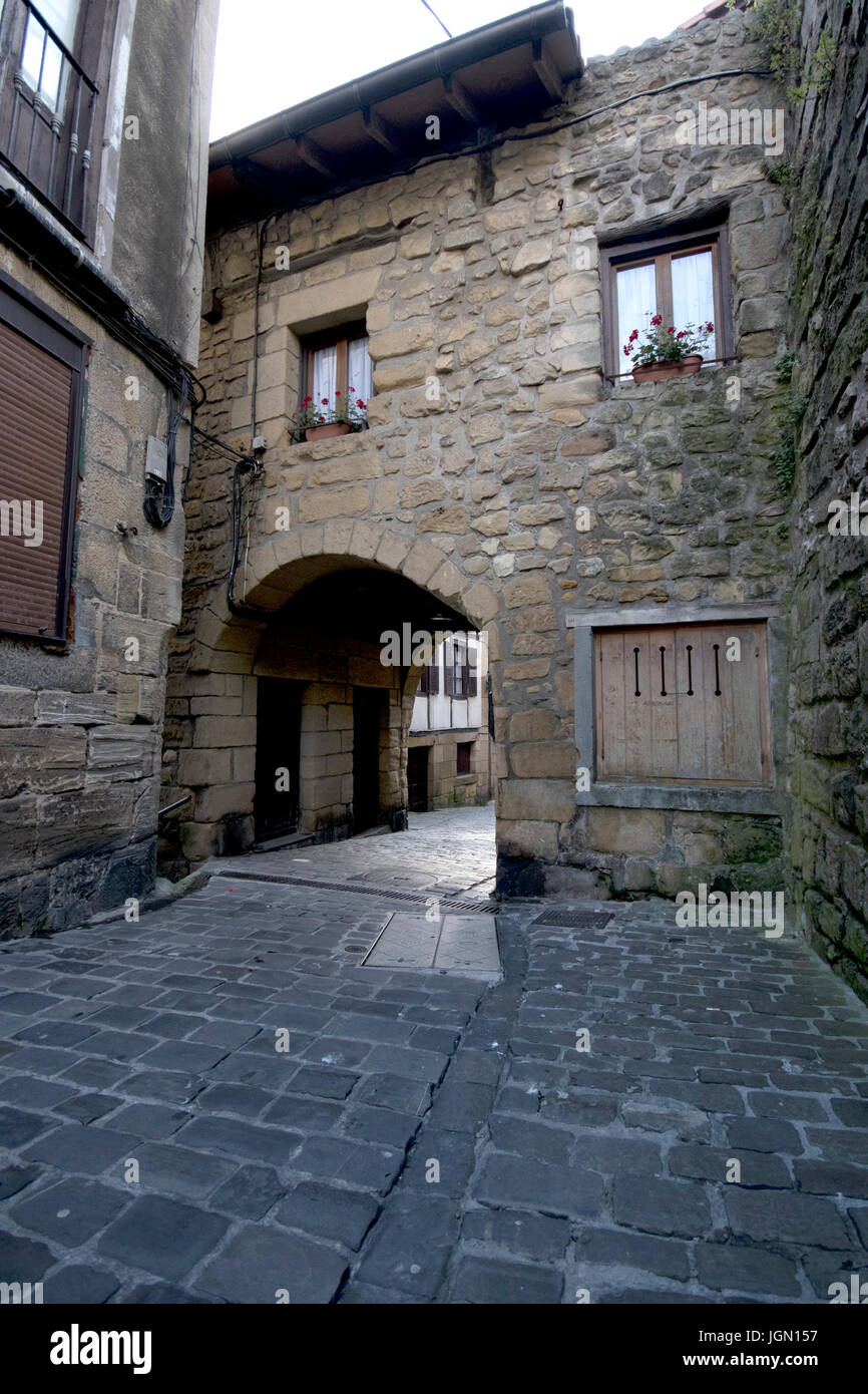 Medieval house with a small street passage in San Juan village - Pasai Donibane (Pasajes, Guipuzcoa, Spain). Stock Photo